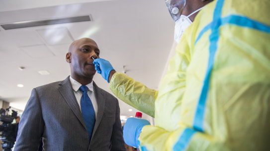 Henderson Lewis Jr., superintendent of schools for Orleans Parish, gets a COVID-19 test in New Orleans. 