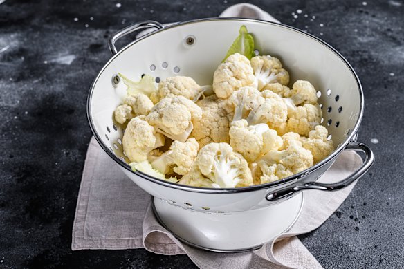 Pour a kettle full of boiling water over cauliflower florets to make them tender. 