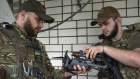 Officers of Ukraine’s 59th Motorised Brigade load a bomb on a drone in Donetsk.