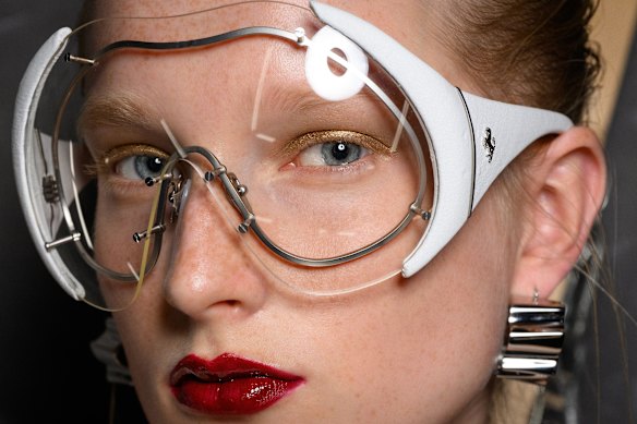 Mask sunglasses add a dash of F1 appeal on the catwalk at the Ferrari show for Milan Fashion Week 2024.