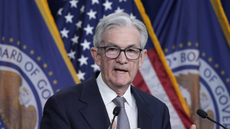 Federal Reserve keeps interest rates on hold, predicts three cuts next year