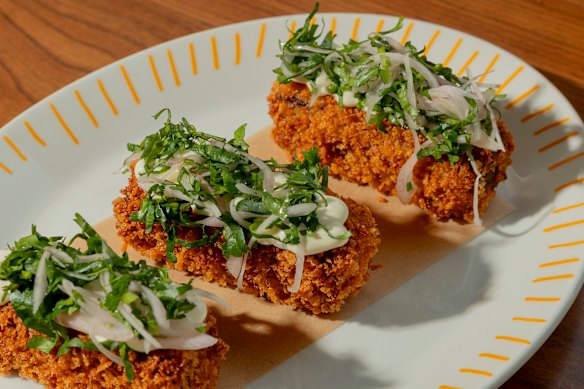 Smoked pork croquette, laughing cow, pickled shallot and coriander.