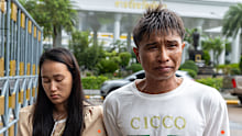 Tongchai Donhomla, right, admitted he felt like he wanted to punch his daughter’s alleged murderer when seeing him in court for the first time.