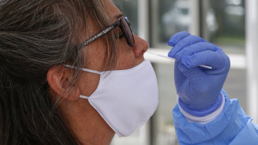 A woman is tested for coronavirus in Salt Lake City, Utah.