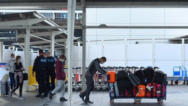 Passengers arrive at Sydney International Airport from Los Angeles that arrived just after 6am on Thursday.