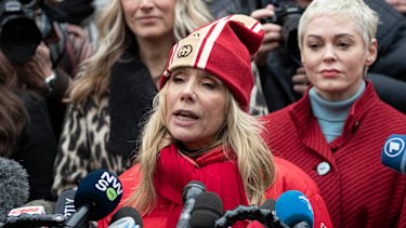 Actors Rosanna Arquette, front, and Rose McGowan spoke outside the Manhattan courthouse.