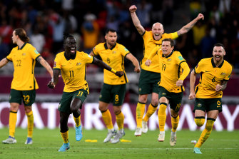 The Socceroos celebrate after winning the game in a penalty shootout.