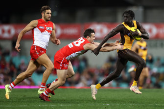 Changkuoth Jiath attempts to break a Swans tackle.
