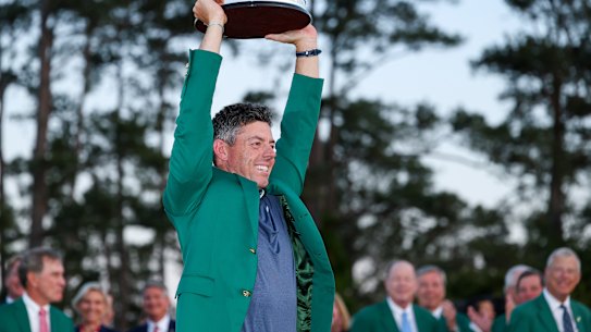 Rory McIlroy poses with the Masters trophy.