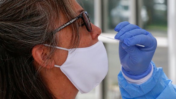 A woman is tested for coronavirus in Salt Lake City, Utah.