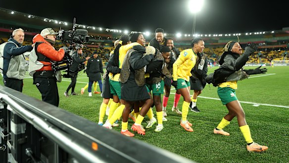 South African players celebrate after beating Italy to make the knockout stage.