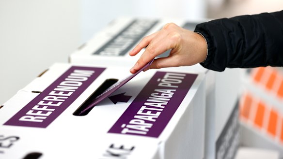 A person casts their referendum vote during election day on October 17.
