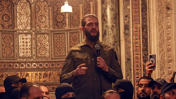 Abu Mohammed al-Jolani speaks at the Umayyad Mosque in Damascus.