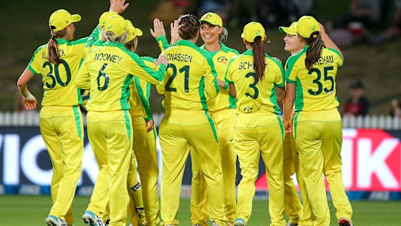 The Australians celebrate after the dismissal of New Zealand captain Sophie Devine.