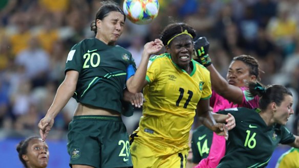 High-flying Matilda Kerr beats Jamaica's Khadija Shaw to the ball.