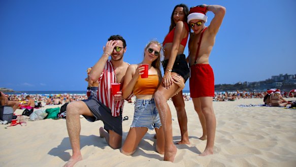 French tourists Louis Duverger, Alina Truc, Cassandre Agostene and Anthony Leveau on Christmas Day at Bondi Beach.