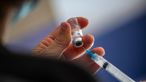 A healthcare worker prepares a dose of COVID-19 vaccine in Santiago, Chile.