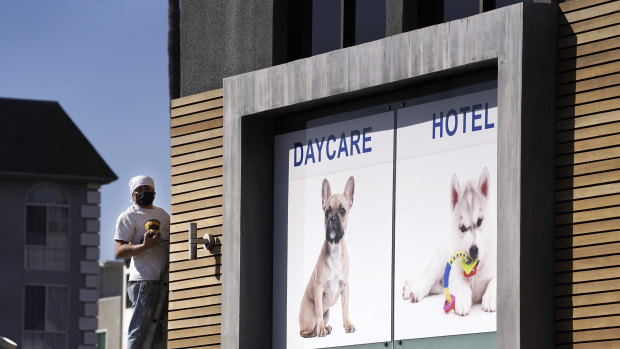 A picture of a French bulldog is featured above the entrance of Dog-E-Den Hollywood, near where Lady Gaga’s dog walker was shot.