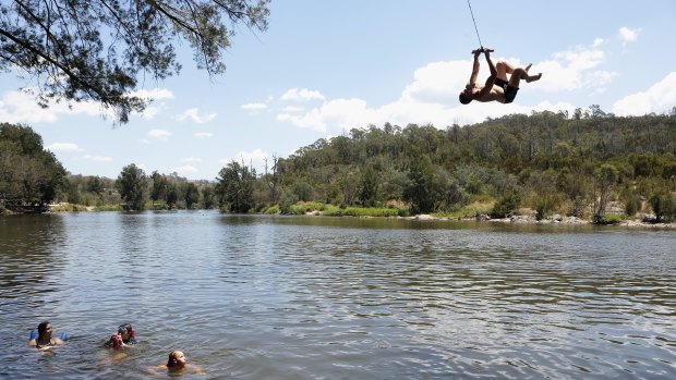Young people at the Casuarina Sands swing in 2014. For many years, the spot has been one of Canberra's favourites for swimming.