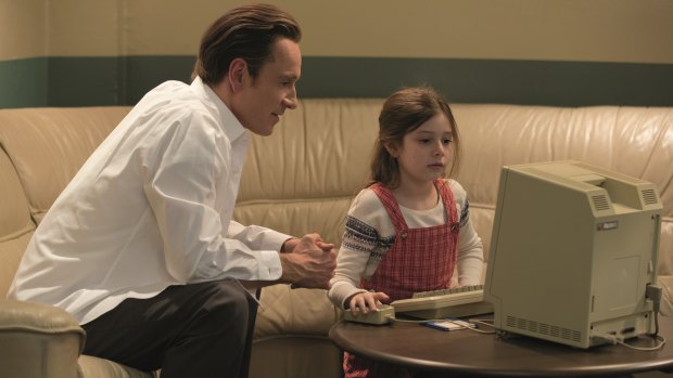 A scene from the film Steve Jobs showing Michael Fassbender as Steve Jobs and his daughter Kate as Lisa. 