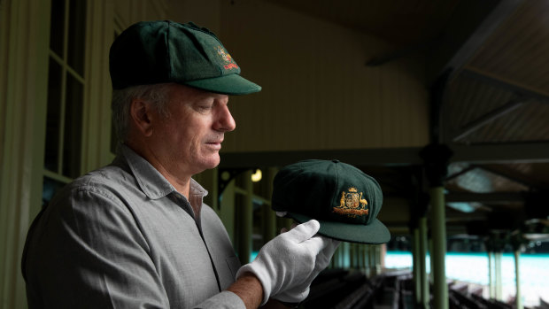 Steve Waugh wearing his cap and holding Don Bradman’s at the Sydney Cricket Ground.