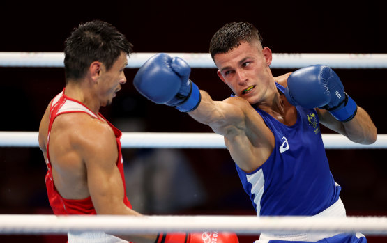 Harry Garside exchanges punches with Zakir Safiullin during his quarter-final in Tokyo. 