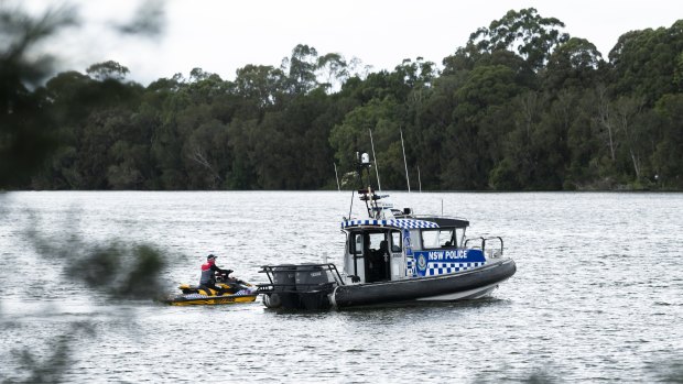 Police search the water on Saturday.