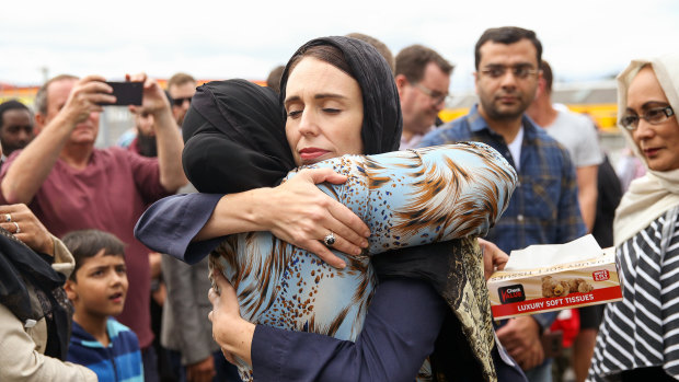 Jacinda Ardern hugs a woman at a mosque in Wellington, two days after the Christchurch mosque shootings.