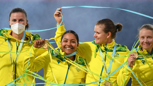 Tahlia McGrath, Alana King, Jess Jonassen and Alyssa Healy pose with their gold medals.