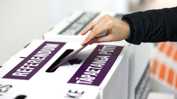 A person casts their referendum vote during election day on October 17.