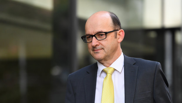 Victoria Police legal services director Fin McRae arrives at the royal commission on Friday. 