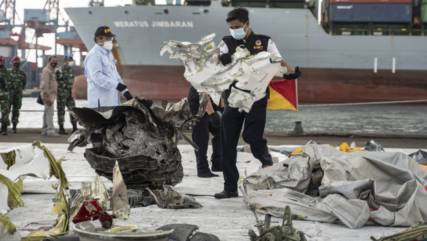 Indonesian authorities have been sorting through debris found in the Java Sea.
