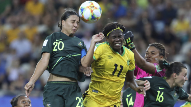 High-flying Matilda Kerr beats Jamaica's Khadija Shaw to the ball.