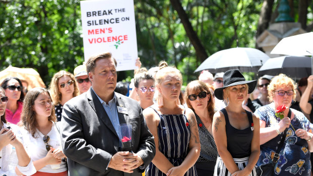 Protesters are seen during a domestic violence protest organised by The Red Rose Foundation in Brisbane, Friday, February 21, 2020.