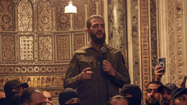 Abu Mohammed al-Golani speaks at the Umayyad Mosque in Damascus.
