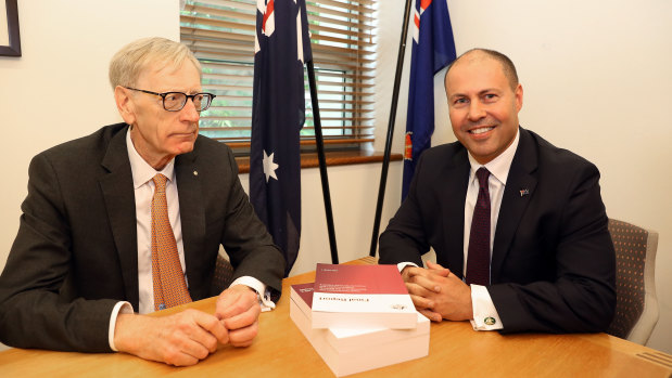 Kenneth Hayne (left) hands over the final report from the banking royal commission to Treasurer Josh Frydenberg on February 1.
