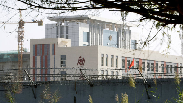 Barbed wire protects the walls around a cluster of schools on the outskirts of Kashgar, in western China's Xinjiang region. 