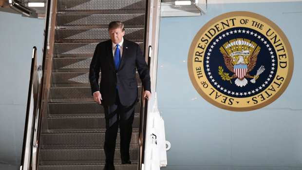 Trump arrived on Air Force One at about 9pm, local time.