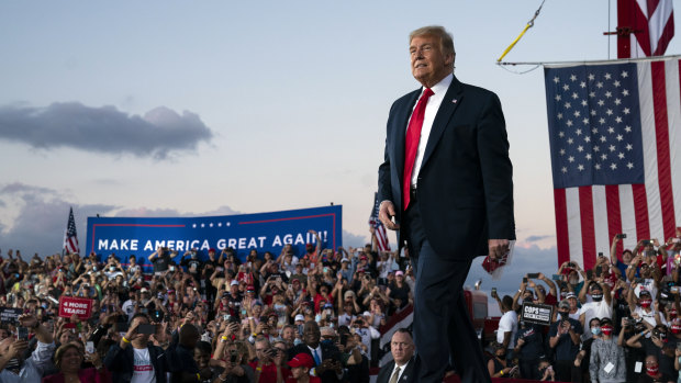 President Donald Trump arrives for a campaign rally at Orlando Sanford International Airport on Monday.