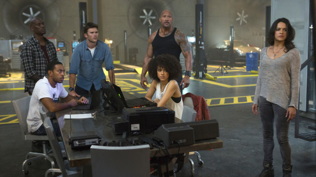 Some of the cast of The Fate of the Furious: Chris “Ludacris” Bridges, seated left, and Nathalie Emmanuel, seated right, and Tyrese Gibson, standing from left, Scott Eastwood, Dwayne Johnson and Michelle Rodriguez.