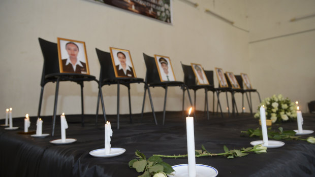 Framed photographs of seven crew members are displayed at a memorial service held by an association of Ethiopian airline pilots in Addis Ababa.