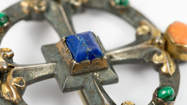 The brooch by the Victorian-era designer and architect William Burges, is made of silver, lapis lazuli, malachite and coral.