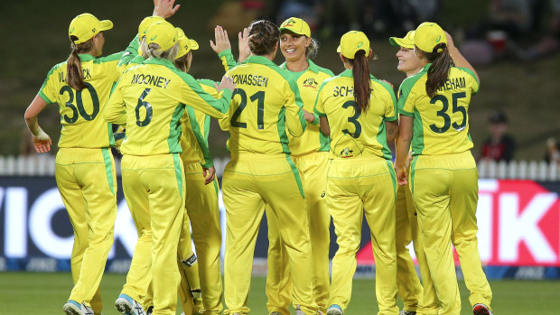 The Australians celebrate after the dismissal of New Zealand captain Sophie Devine.
