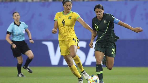 Jamaica's Chantelle Swaby challenges for the ball with Australia's Sam Kerr .