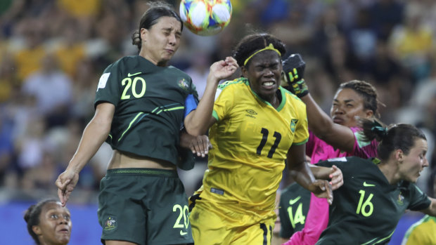 High-flying Matilda Kerr beats Jamaica's Khadija Shaw to the ball.