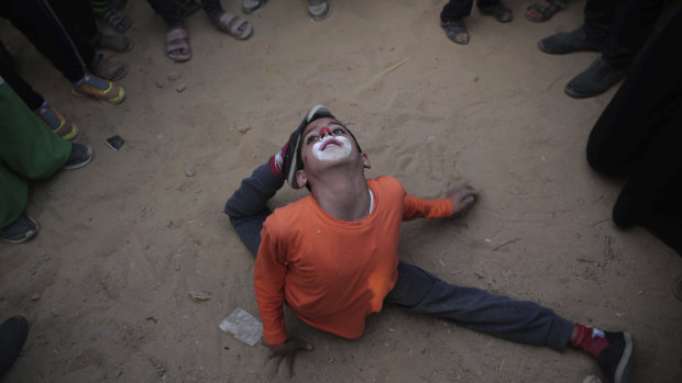 Palestinians give a circus performance as part of an ongoing protest at the Gaza Strip's border with Israel on Wednesday. Hamas has called for Palestinians to amass at the border as part of a week-long campaign of protests.
