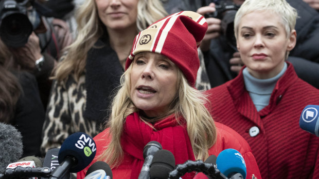 Actors Rosanna Arquette, front, and Rose McGowan spoke outside the Manhattan courthouse.