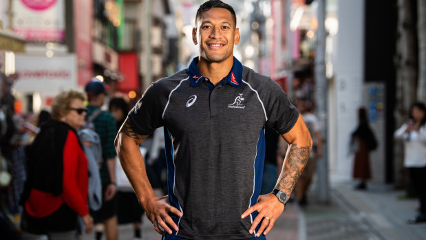 Star attraction: Folau posed for the cameras at a Wallabies fan event at the Asics store in Tokyo last year but was dumped by the brand last month after his anti-gay Instagram post.
