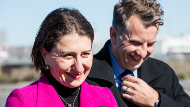 Premier Gladys Berejiklian and Minister for  Roads Andrew Constance brave blustery winds to make an announcement on the Sydney Gateway project on Sunday.