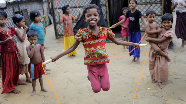 Rohingya children play outside their tents at the Kutupalong refugee camp in Bangladesh on Monday.